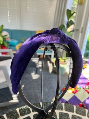 Lele Sadoughi plush deep purple velvet top knot head band, inner brand logo.